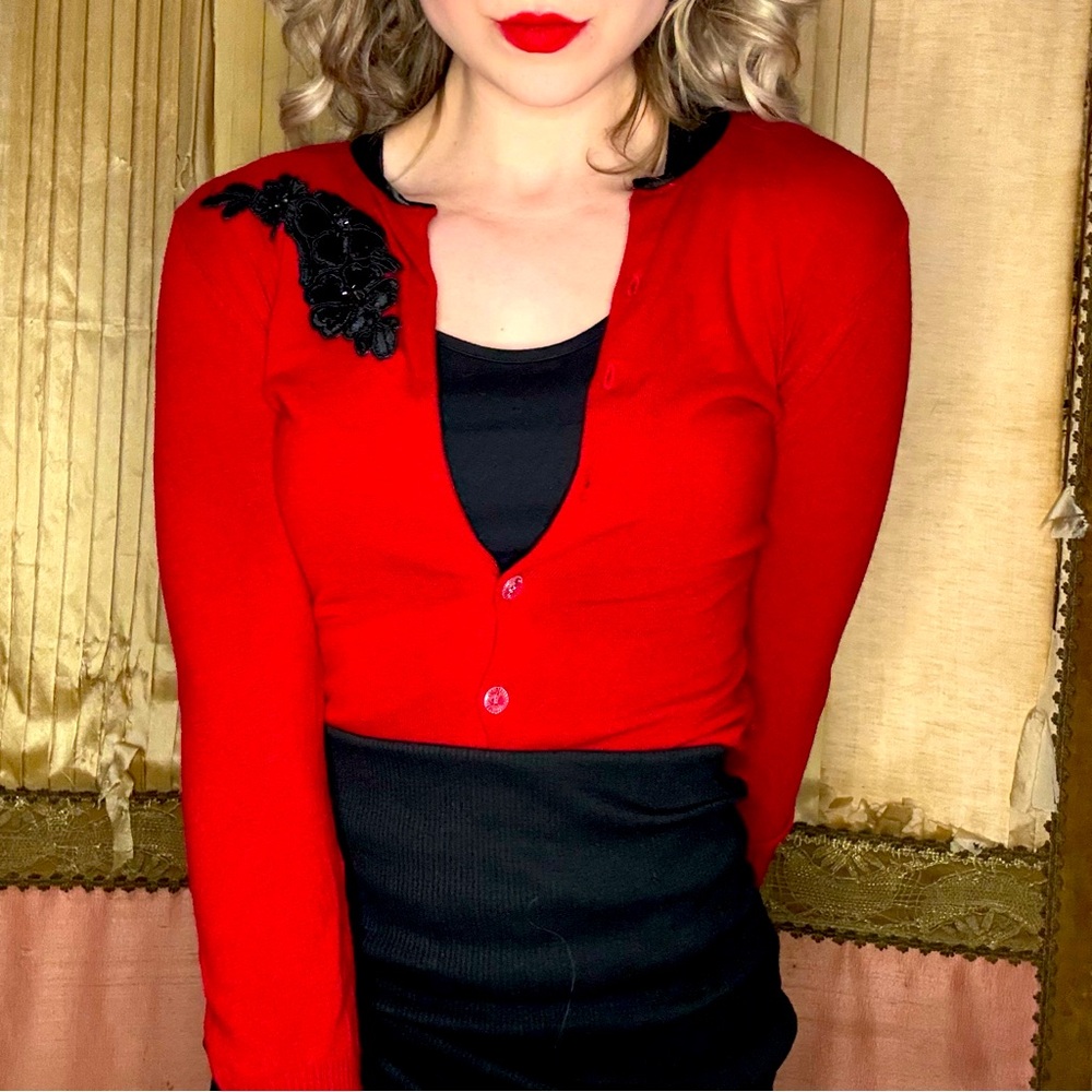 Red and Black cardigan.